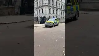 Police Special Escort Group leaving rear exit of Downing Street London Keir Starmer prime minister
