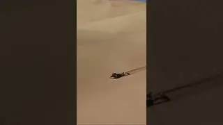 Sand boarder launches off dune.  Sand boarding crash sandboarding fail