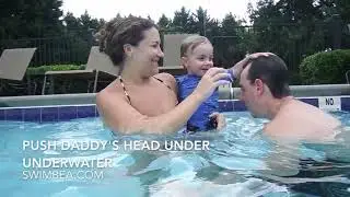 Baby pushes Daddy underwater - baby and Daddy go under together.  swimbea.com