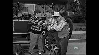 The Three Stooges change a flat tire