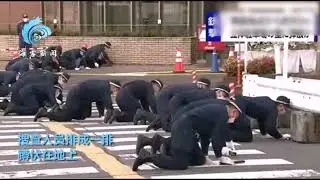 Japanese police crawl on their knees in search of the bullet that killed Prime Minister Shinzo Abe