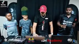 Dj Malice HD demonstrates his skills to some students at the Judah International DJ SUMMIT 2025.