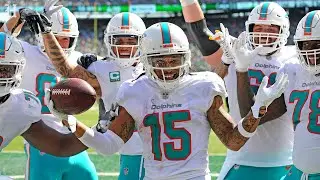 Miami Dolphins Albert Wilson celebrates his first touchdown by posing for photographers in end zone