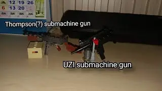 Thompson(?) and UZI submachine gun 