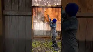 Pressure washing a wood fence