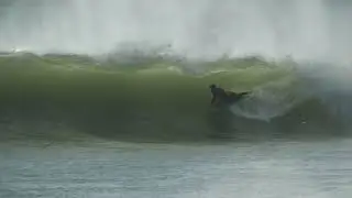 BODYBOARDERS CHARGE NEWCASTLE HARBOUR.