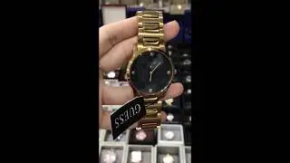 GUESS Men's U0428G1 Sleek Gold-Tone Watch with Diamond Accented Black Dial