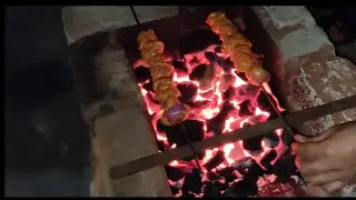 Chicken kebab grilling on barbeque made from brick. #Desi_Jugaad