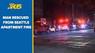 Man rescued from apartment building fire in Seattle