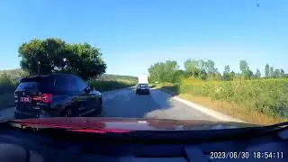 a diplomatic car nearly crashes with a triple overtaking