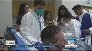 High school students learn about public health through disease outbreak simulation