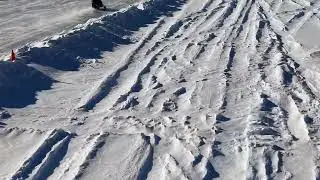 Ann & Jason sledding on Lake Potanipo