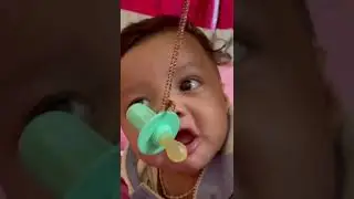 Cute baby boy shimshon reaching for his pacifier