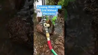 How we got running water off grid without power! #skoolie #offgrid #rampump #homesteading #creek