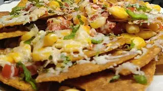 Healthy and tasty homemade sweet corn nachos with salsa , a perfect meal for afternoon cravings 