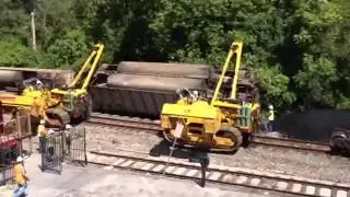 RAW: Train car flipped/removed in derailment cleanup