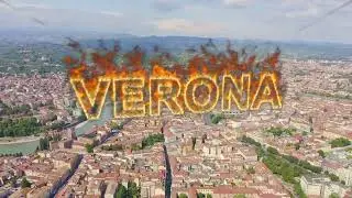 Inscription on video. Verona, Italy. Flying over the historic city center. Arena di Verona, summer.