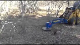 Hydraulic saw attached to SHK mini garden loader