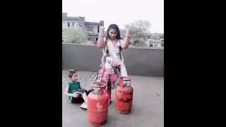 Strong Indian Woman Lift Gas Cylinders Easily