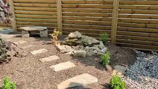 A chipmunk plays by the bubbler