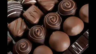 Chocolate Clusters into mold and onto belt