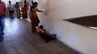 Andhra woman drags husband after hospital denies her stretcher | Oneindia News