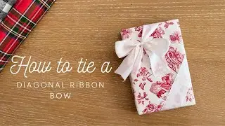 How to tie a diagonal ribbon bow on gift wrapping box