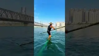 Crossing a river with a bamboo pole?! 🎋🌊 #shorts