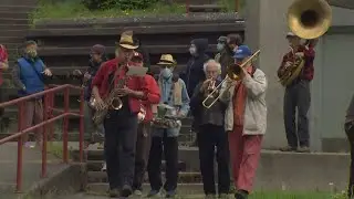 Demonstrators march through Beacon Hill in support of workers' rights, undocumented workers on May 1