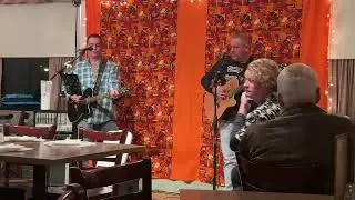 Norwegian Wood at an open mic night. 