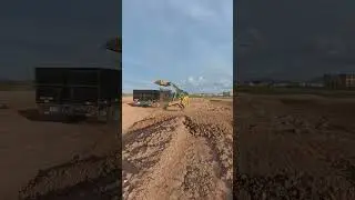 Deere 317G Compact Track Loader Loading Dirt out of a Stock Pile