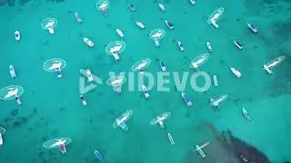 High angle view of fishing boats moored in turquoise water