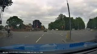 MORONIC CYCLIST JUMPS RED LIGHT AT BUSY CROSSROADS. UK Bad Drivers, Road Rage, observations.