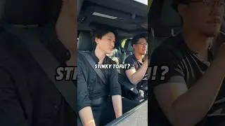 Kazu trying stinky tofu for the first time?