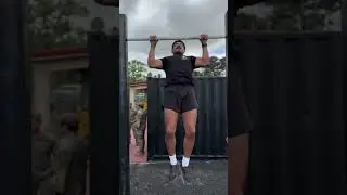 Green Berets evaluate Special Forces candidates on pull-ups during the Special Forces Challenge