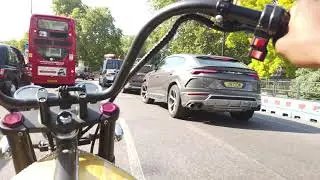 Stirling Eco Electro Ride filtering through Park Lane traffic