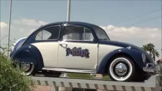 old Volkswagen beetle and VW bus at local car dealer