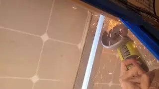Cutting the drip rail to flatten the solar panels...