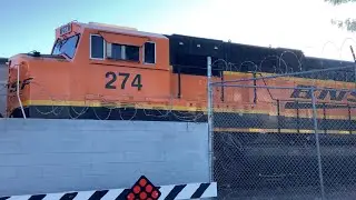 BNSF 1686 moves forward at the BNSF yard along with SD75M 274 