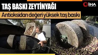 Zeytinyağında dededen kalma taş baskı yöntemini sürdürüyor