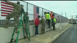 In show of patriotism, local vets hang flags along Valley bridge