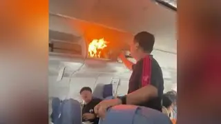 Lithium-ion battery sparks fire in overhead luggage compartment during flight to China