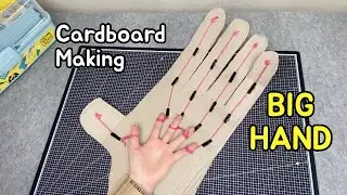 Large hand with cardboard making