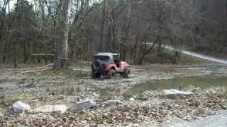 Clarence in his jeep with 36- inch tires