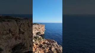 Last seconds dancing on the slackline over the cliff of Porto Cristo
