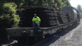 Mass Coastal Railroad MC-4 with rail train on Ex-DODX Military Flatcars