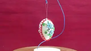 Quilling Easter egg, red frame and blue flowers