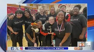 BRIGHT SPOT: Urbana High School Winter Guard team celebrates victories
