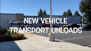 Lexus transporter new vehicle unloads