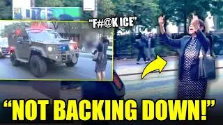 Женщина в платье в горошек противостоит агентам ICE на улице